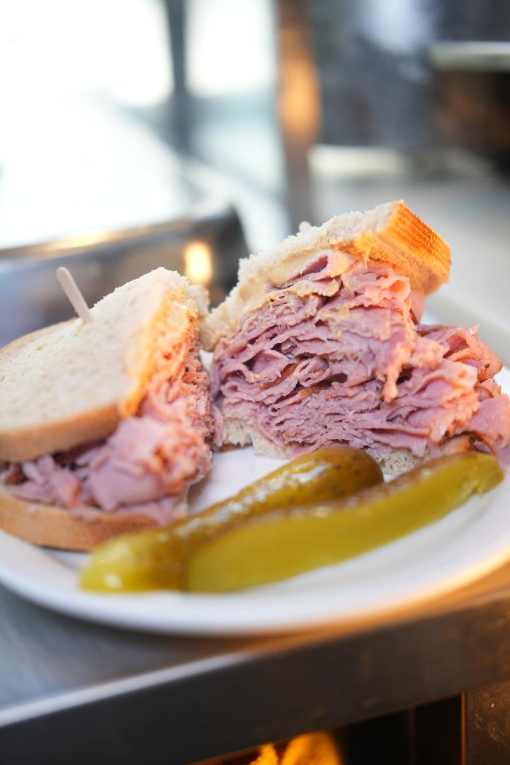 Avenue Open Kitchen Montreal-style smoked meat sandwich on rye with pickle